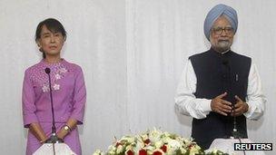 India's Prime Minister Manmohan Singh, right, talks to reporters during a news conference after a meeting with Burma's pro-democracy leader Aung San Suu Kyi in Sedona Hotel in Rangoon on 29 May, 2012