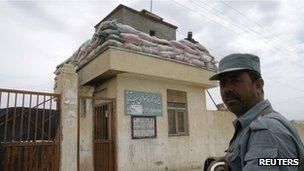 File photo (May 2012) of guard outside Afghan school