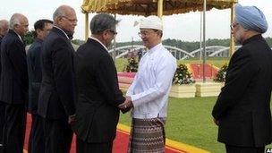 A handout photogaph showing Indian Prime Minister Manmohan Singh looking on as Burma's President Thein Sein meets India's delegation.