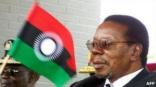 Malawi's President Bingu wa Mutharika waves the new flag at the launch of the new national flag on 7 August 2010