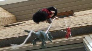 Toys dangling from window