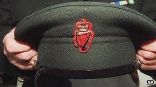 RUC officer holds his cap