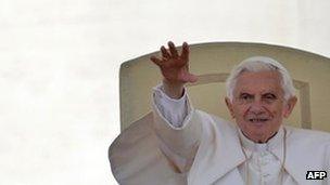 Pope Benedict XVI waves during his weekly general audience