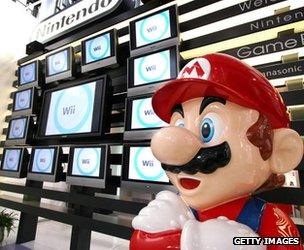 Mario model stands in front of Wii display