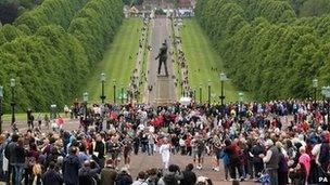 The torch is carried towards Stormont, home of the Northern Ireland Executive