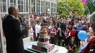 British ambassador to France Sir Peter Ricketts, left, delivers his speech to his guest during a ceremony given at the British Embassy in Paris Sunday June 3, 2012