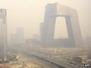 The new China Central Television headquarters building is covered in haze in Beijing in March