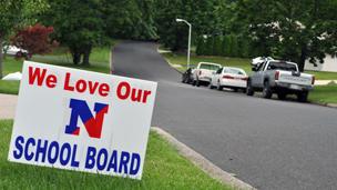 A sign for We Love our School Board