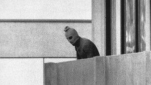 Masked man on balcony in Olympic village in Munich 1972