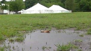 Puddles and tents at Peel Park