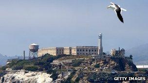 A seagull flies over Alcatraz Federal Penitentiary on Alcatraz Island 2 July 2003