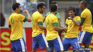 Brazil's players celebrate a goal in a friendly against Argentina on 9 June 2012