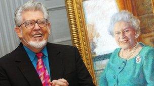 Rolf Harris with his portrait of the Queen