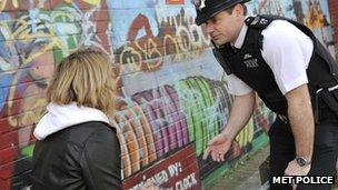 Police officer speaking with a youth