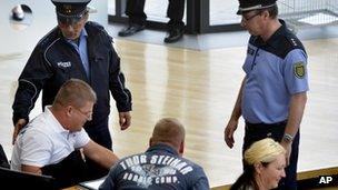 Police ask lawmakers of the right-wing NPD party to leave the federal parliament of Saxony state in Dresden