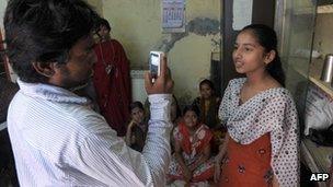 A Video Volunteer Dalit community correspondent interviewing a girl