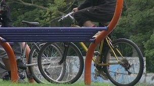 Teenagers on bikes in park