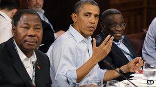 US President Barack Obama sits with Ghana President John Atta Mills, right, and President Yayi Boni of Benin during a luncheon on food security at the G8 Summit in May 2012