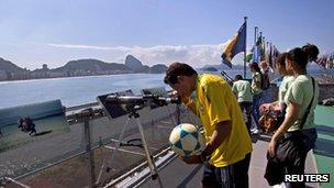 Man peers through telescope in Rio de Janeiro