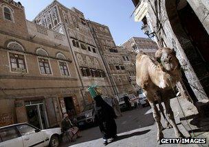 Men rest in shade in Sanaa in Yemen