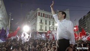 Alexis Tsipras, the head of Greece's leftist Syriza party, waves at supporters during a pre-election rally in Athens June 14 2012