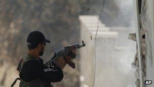 Free Syrian Army fighter fires weapon in Idlib - 15 June