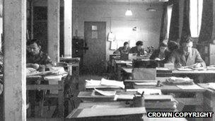 Wartime photograph of cryptanalysts working at Bletchley Park