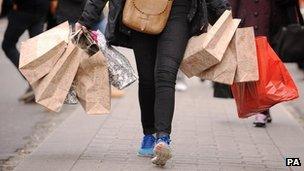 A woman carrying shopping bags