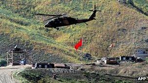 Helicopter flies above Turkish army outpost in Hakkari province on 19 June 2012