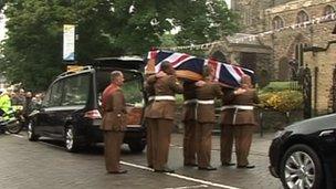 Cortege carrying coffin of Pte Gregg Stone into church