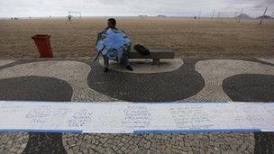 An umbrella seller at Copacabana Beach in Rio de Janeiro