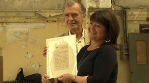 Dr John Martin and Kate Dornan with the coveted letter