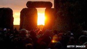 Sun rising at Stonehenge