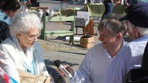 Tony Vale interviewing a couple celebrating their 60th wedding anniversary, who were guests at the Wymondham Diamond Jubilee celebrations