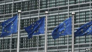 Flags lines up outside the EU commission headquarters in Brussels