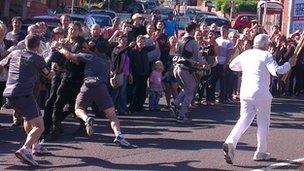The torch security team intercept a man with a bucket of water