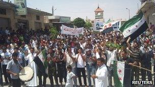 Anti-government demonstrators at a rally in Idlib, Syria