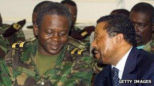 Coup leader negotiates with Gabonese foreign minister Jean Ping, right