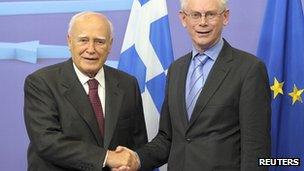 European Council President Herman Van Rompuy poses with Greek President Karolos Papoulias (L) before their meeting at the EU Council in Brussels on 27 June 2012