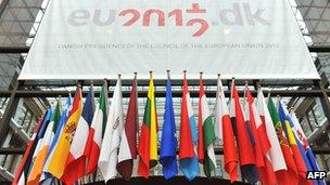 EU country flags are on display in the great hall of the EU Council in Brussels on 27 June 2012