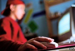 Teenage boy using computer