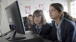 School girls looking at a computer screen