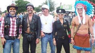 Festival-goers dressed as the band The Village People