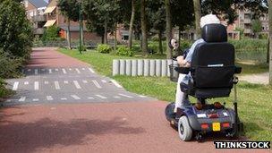 Elderly woman on a mobility scoote