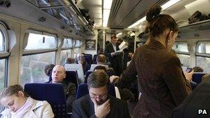 Passengers on crowded train