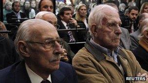 Former Argentine military leaders Jorge Videla (l) and Reynaldo Bignone (r) during their trial in a courthouse in Buenos Aires on 5 July, 2012