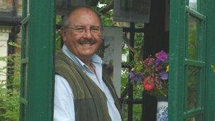 John Hay in his art gallery. Photo by Phil Hunt.