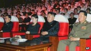 In this image made off North Korea's KRT video footage, North Korean leader Kim Jong Un, second from right, watches performances by North Korea's new Moranbong band in Pyongyang 6 July, 2012