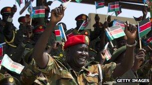 South Sudanese military wave the national flag celebrating the anniversary of South Sudan"s first Independence day on July 9, 2012 in Juba, South Sudan