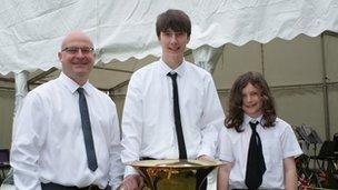 John Powell (left), conductor of the Denbighshire County Brass Band, with band members William Foulkes and Johnny Davies